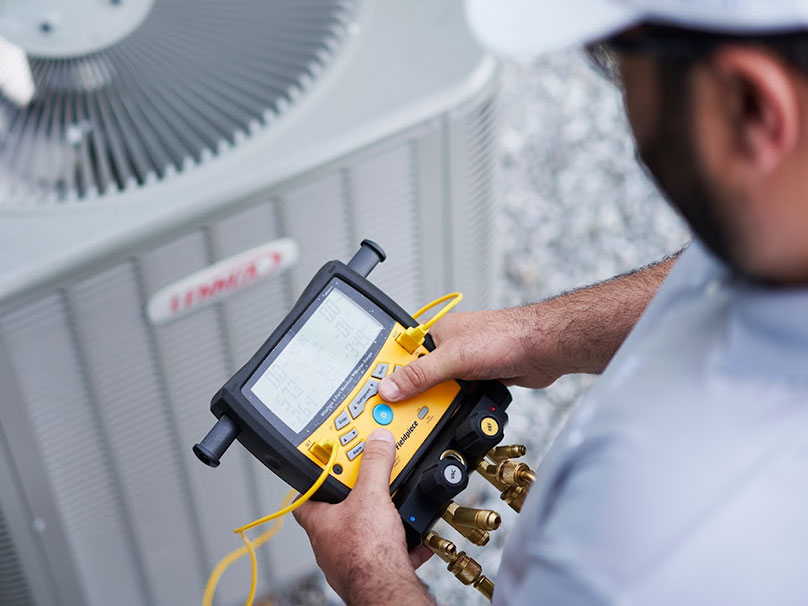 Lakeside Tech repairing an air conditioner